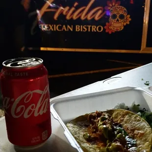 a can of coke and a taco