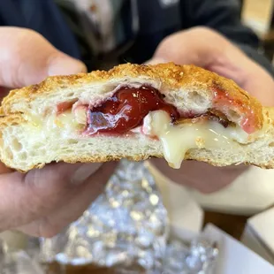 Pressed sandwich with brie cheese and cherries