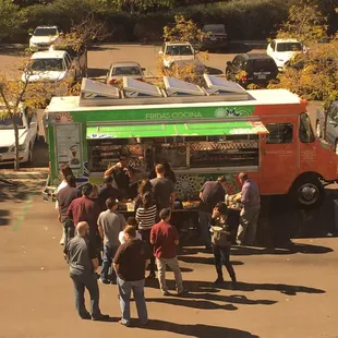 people standing in a parking lot