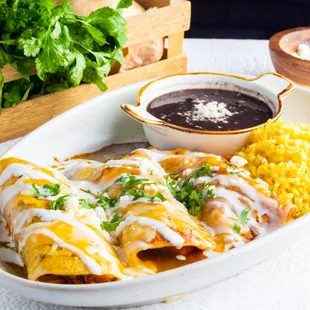 Trio Enchiladas with rice and beans