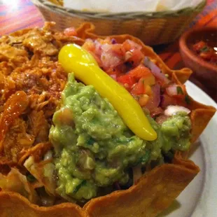 Taco salad with shredded chicken.