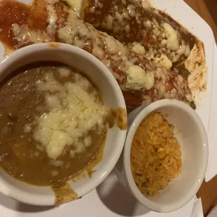 Lunch combination platter:  cheese enchilada, ground beef burrito, rice, and refried beans