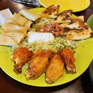 Frida&apos;s Sampler. Wings were crispy w a drizzle of Buffalo sauce