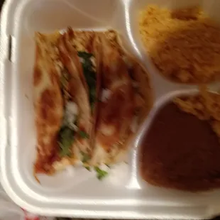 Pollo quesadilla platter. Not the cheesy kind that we were expecting. They&apos;re in fried flour tortillas. Yummy.