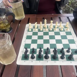 Iced tea, chess club in the outdoor patio area.