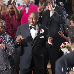 a man in a tuxedo and a woman in a sequinous dress