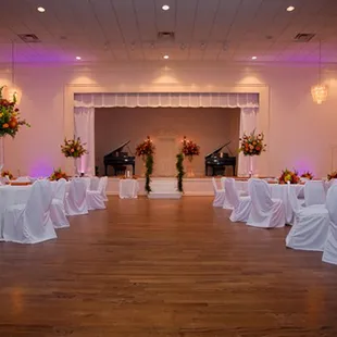 a large room set up for a wedding reception