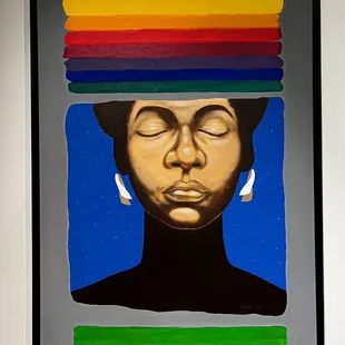 a painting of a woman's face with a rainbow on her head