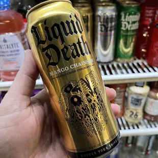 a hand holding a can of donut death
