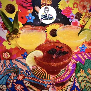 two margaritas on a colorful table cloth