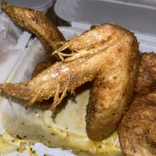 A nasty feather infested uncooked piece of chicken!!!