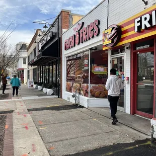 a man walking down the sidewalk
