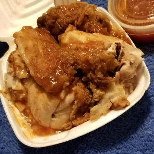 Chicken with the sauce, coconut rice and peas, plus extra sauce on the side