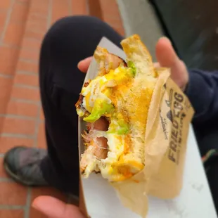 Huevo Mutiliation with egg, seared ham, caramelized onion, aardvark aioli, and cheddar on sourdough