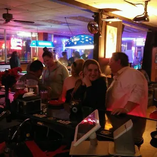 a group of people at the bar