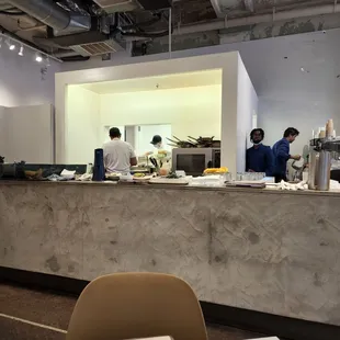 people in a kitchen preparing food