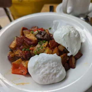 Breakfast potatoes and poached eggs (brunch menu)