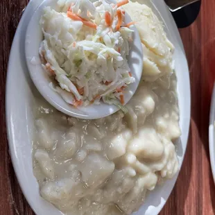 Chicken and noodles, mashed potatoes and coleslaw