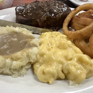 Friend's meatloaf, mashed potatoes with brown gravy, Mac &amp; cheese &amp; onion rings.