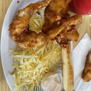 a plate of fried chicken wings and sauerkraut