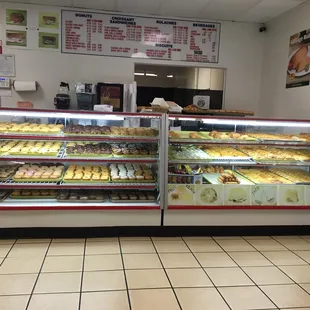 a display case with a variety of donuts