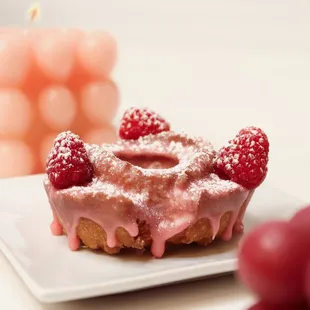 Blood Orange Old Fashion 
A zesty blood orange glaze, topped with fresh raspberries and a dust of powdered sugar.