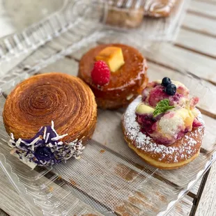 Ube toasted coconut croissant wheel, blueberry lemon tiramisu, flan dossant