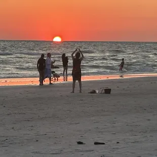 Gorgeous sunset that I watched at the sugary sand beach right across the street through the parking lot from Friendlys Tavern