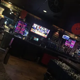 a bar with a lot of neon lights