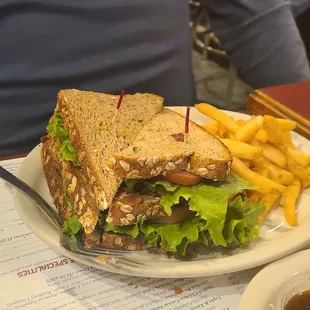 BLT on wheat bread and fries.