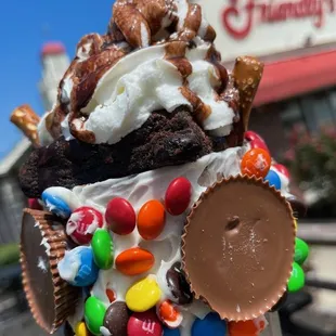an ice cream sundae topped with candy
