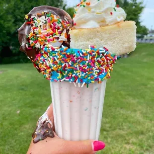 an ice cream sundae with sprinkles