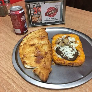 Beautiful 10 inch calzone stuffed with pepperoni and bulk olives and a beef pattie loaded with goodies