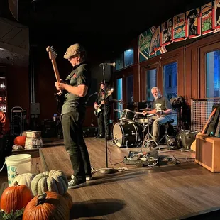 a man playing a guitar on stage