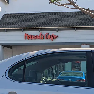 a car parked in front of the restaurant