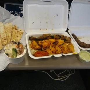 Combo lamb and chicken with a side of bread and kabob. 30 with deliver...