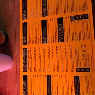 a menu and a bottle of wine