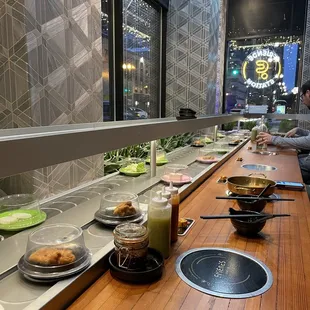 a long counter with a variety of food items