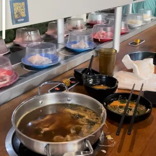 You pick your food from the belt.