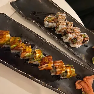 two plates of sushi on a table