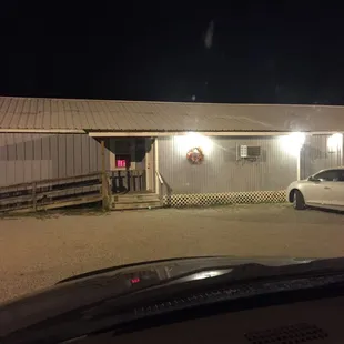 a white car parked in front of it