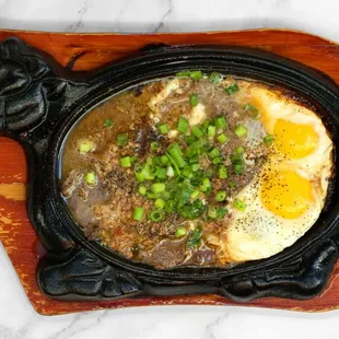 a black cast iron skillet filled with food