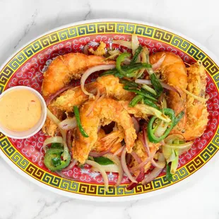 a plate of shrimp and vegetables