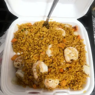 shrimp and rice in a styrofoam container