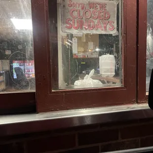a window with a closed sign