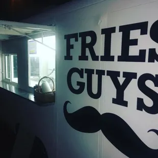 a sign on a food truck