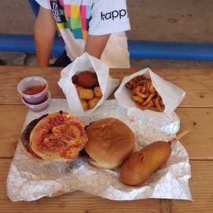 Burger, bacon cheeseburger, for dog and various fried sides.