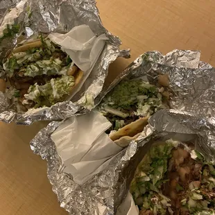 Gigantic street tacos filled with awesome cabeza cilantro, onion, cream &amp; beans got 3 but they are huge portions