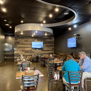 people sitting at tables in a restaurant