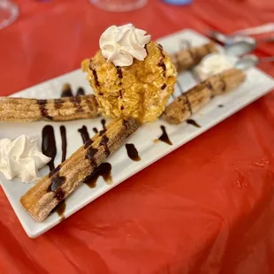 Fried vanilla ice cream with churro. DELICIOUS!